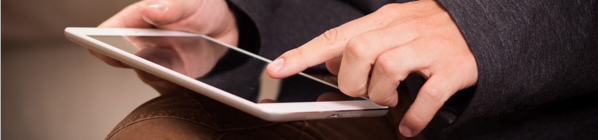 Hands working on tablet