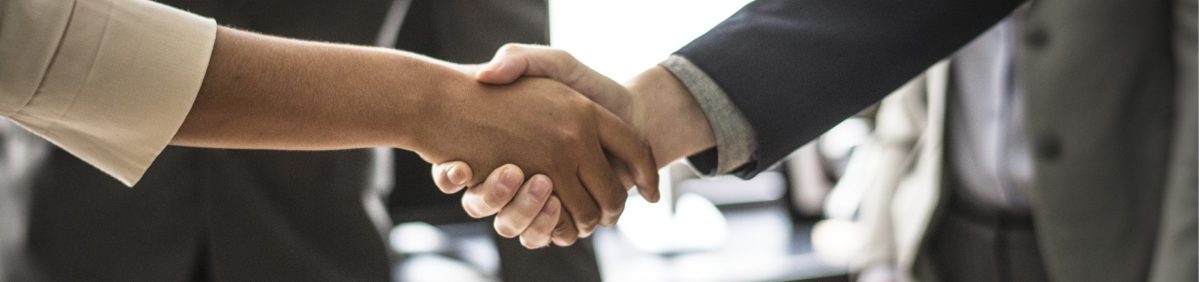 Handshake between man and woman